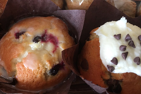 Two delicious muffins at Beach Break Bakrie & Cafe in Bethany Beach, Delaware, where guests can enjoy a free choice of muffin at Xplorie participating properties.