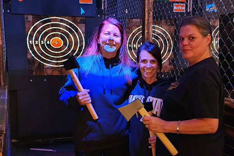 Experience an axe throwing session at Hero's Axe Throwing in Seven Devils, North Carolina, where guests staying at Xplorie participating properties can enjoy for free.