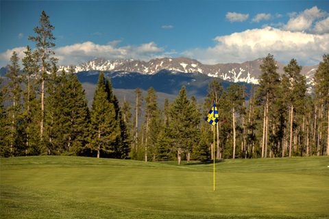 A beautiful sight of the mountains and course at Pole Creek Golf Club in Tabernash, Colorado, where you can enjoy a free round of golf when you stay at Xplorie participating properties.