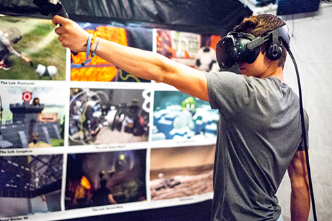 A young man enjoys a virtual reality experience at Sunriver Virtual Reality in Sunriver, Oregon, where guests staying at Xplorie participating properties can enjoy a free one hour VR experience.