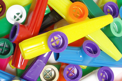 A pile of colorful kazoos at The Kazoo factory in Beaufort, South Carolina, where guests staying at Xplorie participating properties can enjoy a free admission.