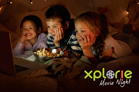 Children enjoying free movie rentals from Xplorie Movie Nights.